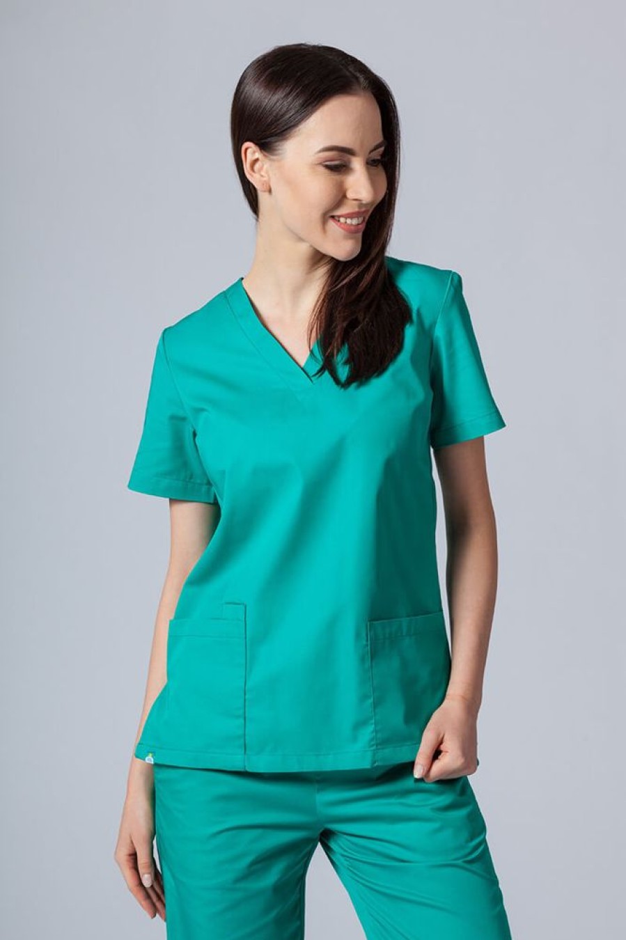 Ona Sunrise Uniforms | Komplet Medyczny Damski Sunrise Uniforms Basic Classic (Bluza Light, Spodnie Regular) Zielony